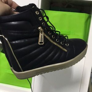 Black and gold boots